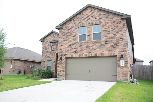 front of property with a garage and a front lawn