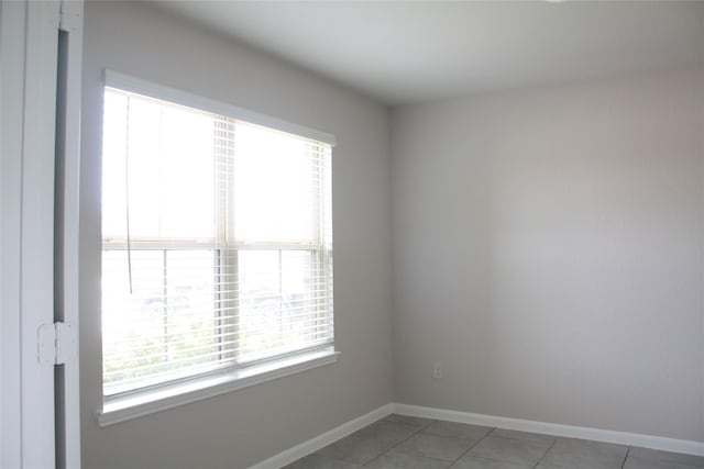 spare room with tile patterned flooring