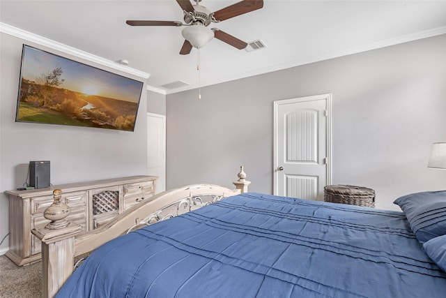 bedroom featuring ornamental molding, ceiling fan, and carpet flooring