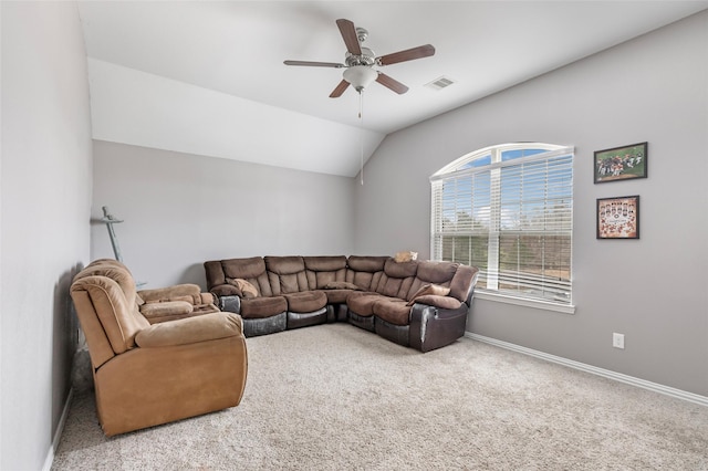 living room with ceiling fan, lofted ceiling, and carpet