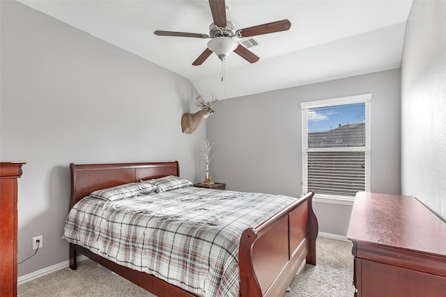 carpeted bedroom with ceiling fan and lofted ceiling