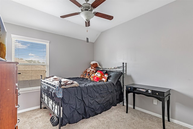 carpeted bedroom with lofted ceiling and ceiling fan