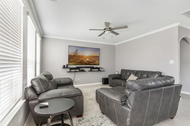 tiled living room featuring ornamental molding and ceiling fan