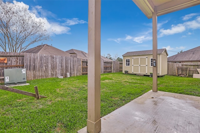 view of yard with a patio area and a storage shed