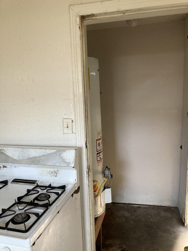 interior space with white gas stove and gas water heater