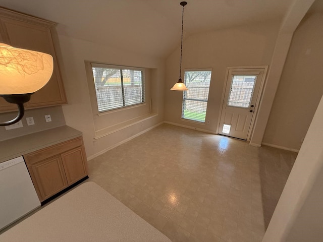 unfurnished dining area with vaulted ceiling