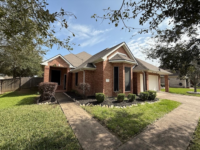 view of front of home featuring a garage and a front lawn