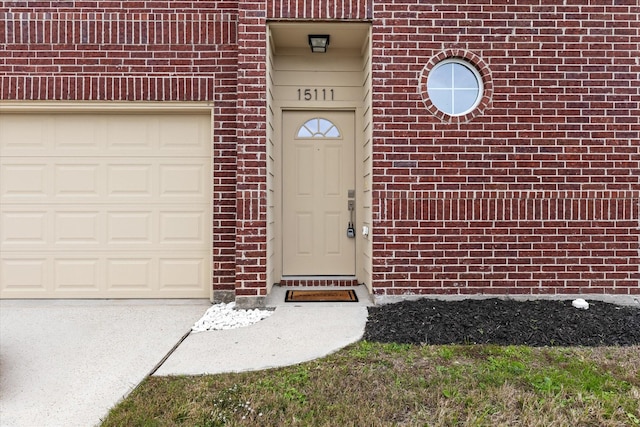 doorway to property featuring a garage