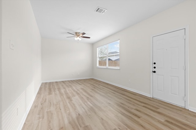 empty room with ceiling fan and light wood-type flooring