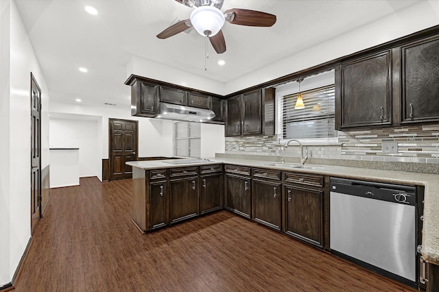 kitchen featuring a peninsula, electric cooktop, a sink, dishwasher, and dark wood finished floors