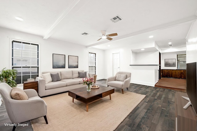 living room with beamed ceiling, dark wood-style flooring, visible vents, and baseboards