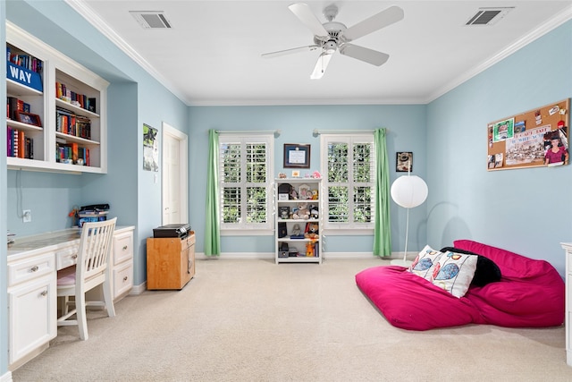 interior space featuring carpet, built in desk, visible vents, ornamental molding, and baseboards