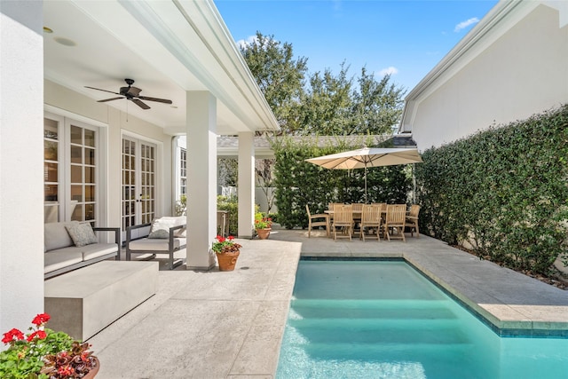 pool featuring a ceiling fan, a patio, an outdoor hangout area, french doors, and outdoor dining space