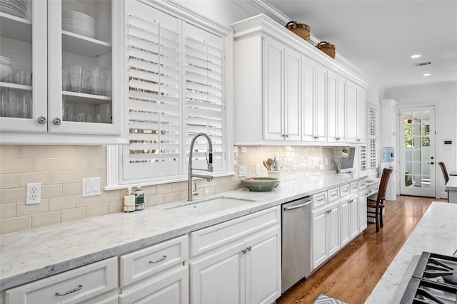 kitchen featuring dark wood-style flooring, glass insert cabinets, white cabinets, a sink, and dishwasher