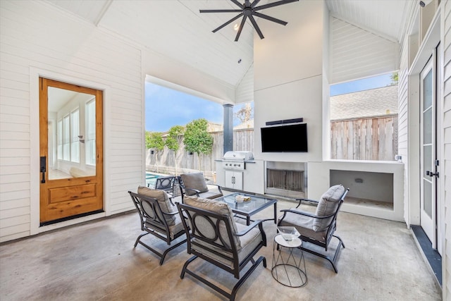 interior space featuring french doors, ceiling fan, grilling area, and a fireplace