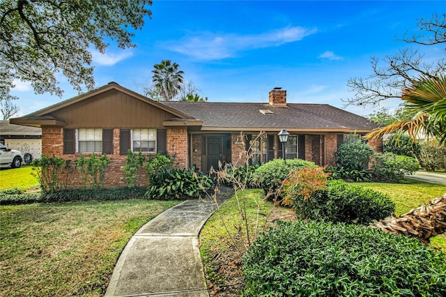 ranch-style house featuring a front lawn