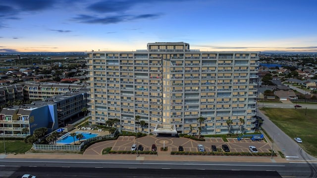 view of outdoor building at dusk