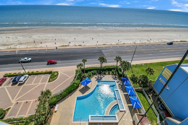 drone / aerial view with a view of the beach and a water view