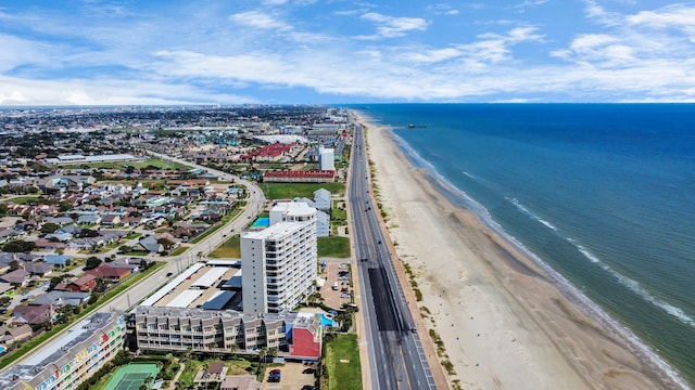 drone / aerial view with a water view and a beach view