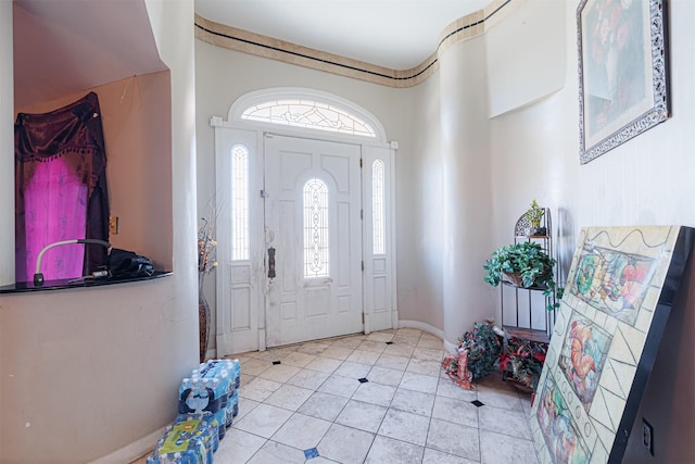 entrance foyer with light tile patterned floors