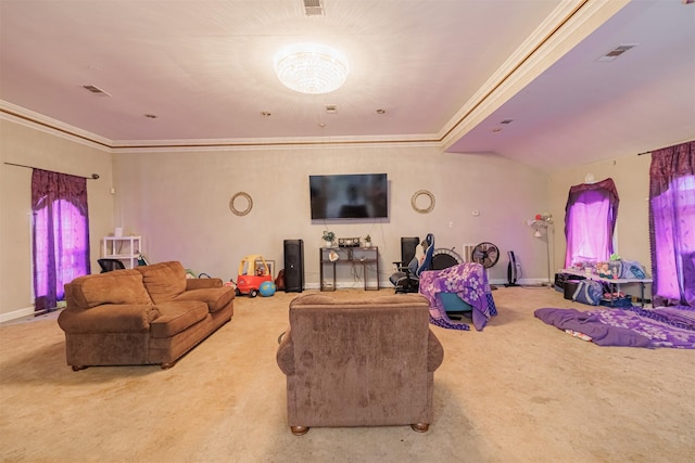 carpeted living room with a healthy amount of sunlight and ornamental molding