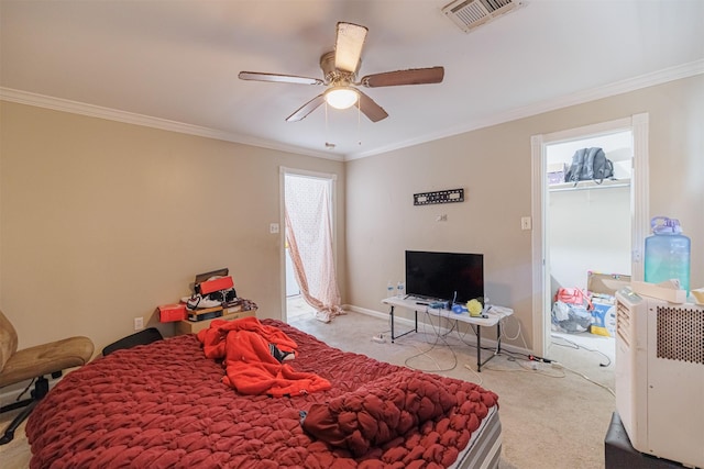 bedroom featuring crown molding, light colored carpet, and ceiling fan