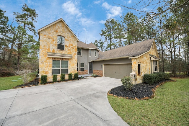 view of front property with a garage and a front yard