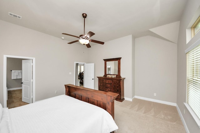 bedroom with ceiling fan and light carpet