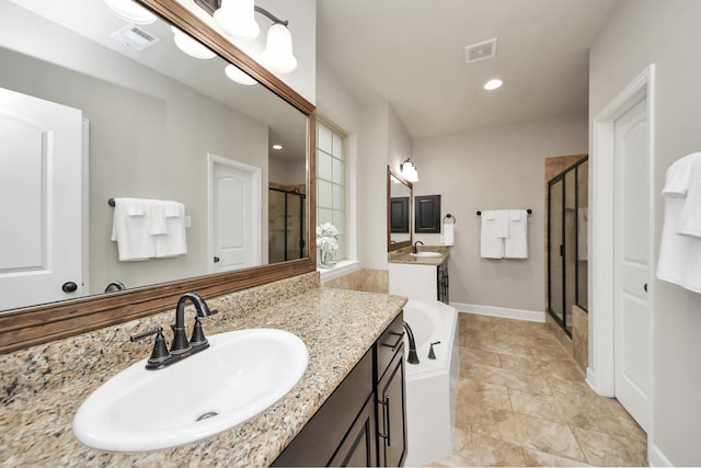 bathroom featuring walk in shower and vanity