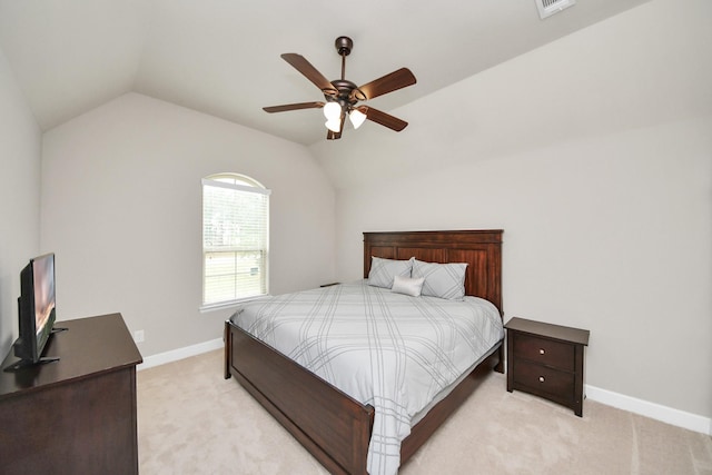 bedroom with lofted ceiling, light carpet, and ceiling fan