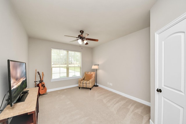 living area featuring ceiling fan and carpet floors