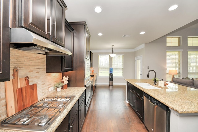 kitchen featuring decorative light fixtures, tasteful backsplash, sink, dark hardwood / wood-style flooring, and stainless steel appliances