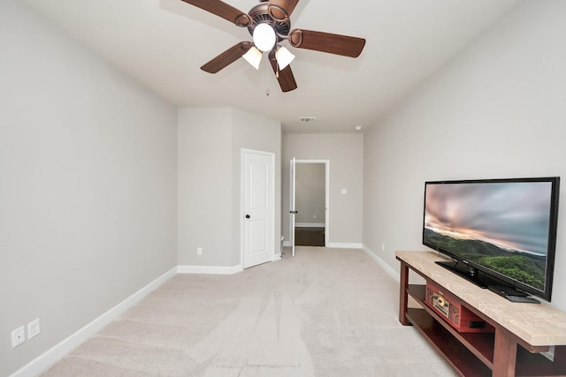 unfurnished living room with light colored carpet and ceiling fan