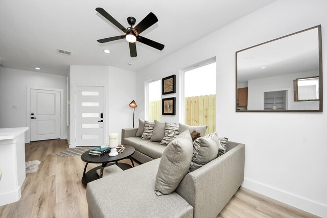 9026 Scott St, Houston, TX 77051 - living room with ceiling fan, light wood-type flooring, visible vents, recessed lighting, and baseboards