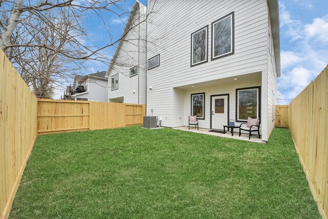 9026 Scott St, Houston, TX 77051 - back of property with a patio, a yard, cooling unit, and a fenced backyard