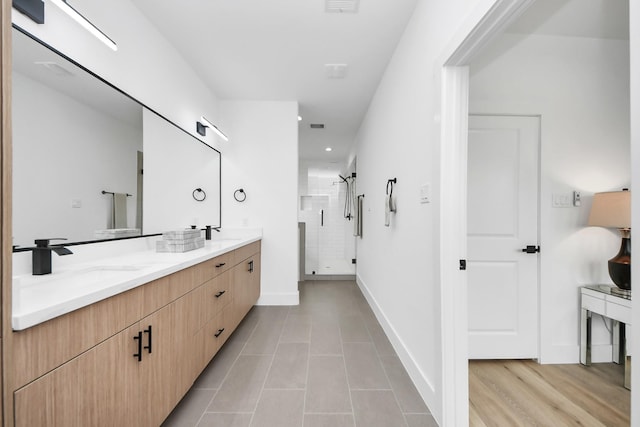 9026 Scott St, Houston, TX 77051 - full bathroom featuring a shower stall, tile patterned flooring, double vanity, and a sink