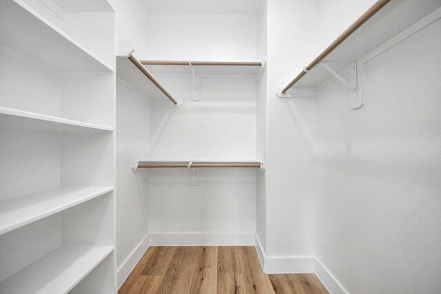 9026 Scott St, Houston, TX 77051 - walk in closet with wood finished floors