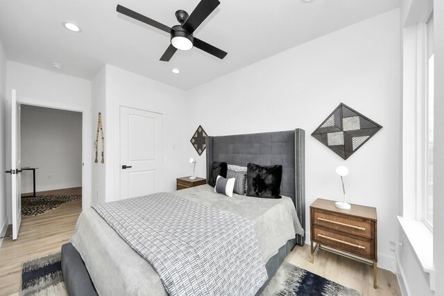 9026 Scott St, Houston, TX 77051 - bedroom featuring ceiling fan, recessed lighting, wood finished floors, and baseboards