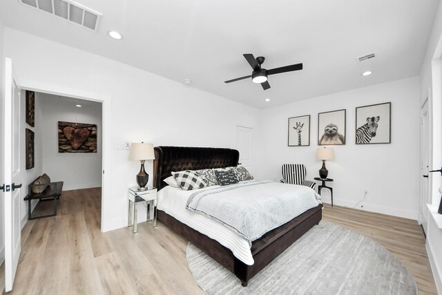9026 Scott St, Houston, TX 77051 - bedroom with light wood-style flooring, baseboards, a ceiling fan, and visible vents
