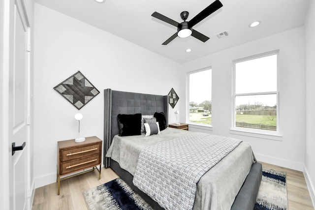 9026 Scott St, Houston, TX 77051 - bedroom featuring visible vents, baseboards, recessed lighting, and light wood-style floors