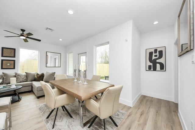 9026 Scott St, Houston, TX 77051 - dining room with light wood-style floors, baseboards, and visible vents