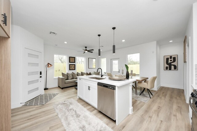 9026 Scott St, Houston, TX 77051 - kitchen with open floor plan, visible vents, ceiling fan, stainless steel appliances, and a sink