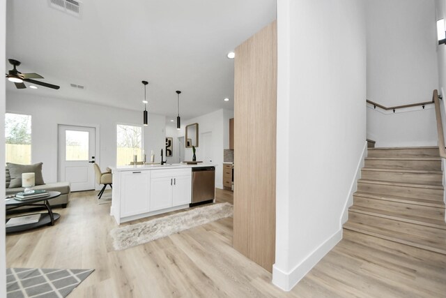 9026 Scott St, Houston, TX 77051 - kitchen featuring light wood-style floors, open floor plan, dishwasher, and visible vents