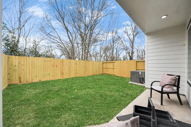 9026 Scott St, Houston, TX 77051 - view of yard featuring a patio, a fenced backyard, and central AC unit