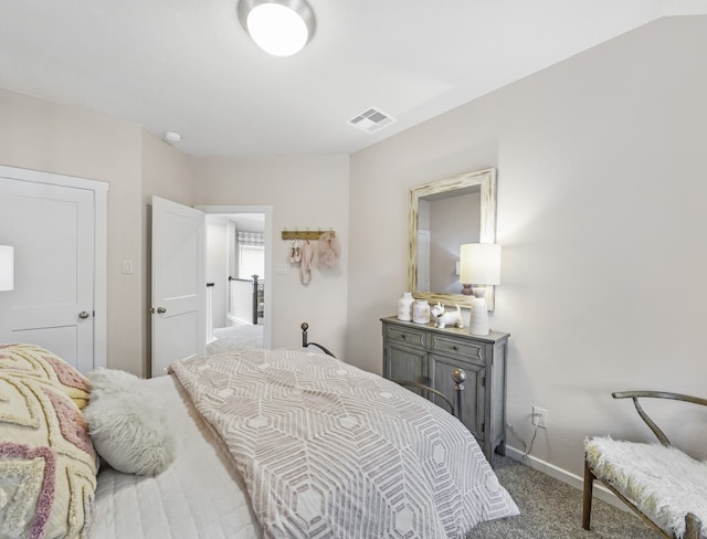 carpeted bedroom with baseboards and visible vents