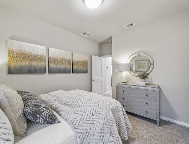 bedroom with light colored carpet, visible vents, and baseboards