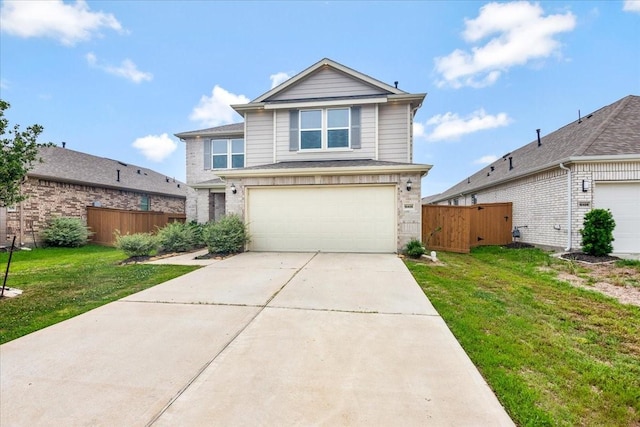 view of property with a garage and a front lawn