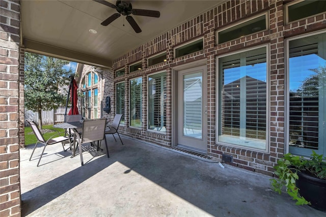 view of patio featuring ceiling fan