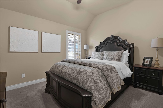 carpeted bedroom with ceiling fan and vaulted ceiling