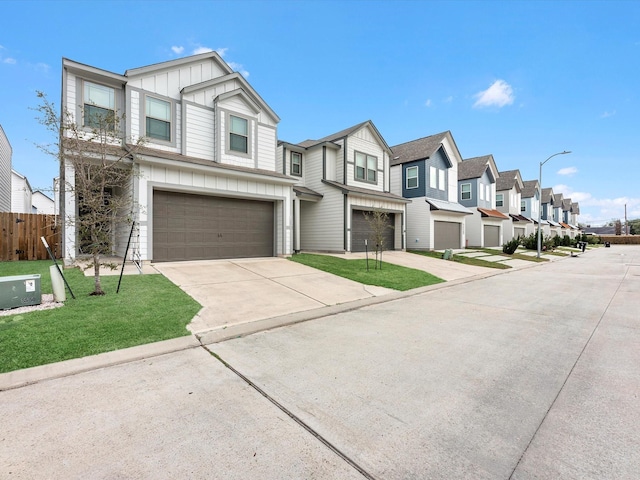 townhome / multi-family property with a garage and a front yard